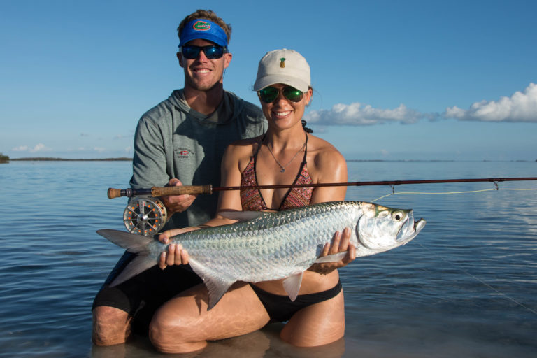 Shawn and Sophie hold a beautiful they caught on fly in the backcountry off of key west