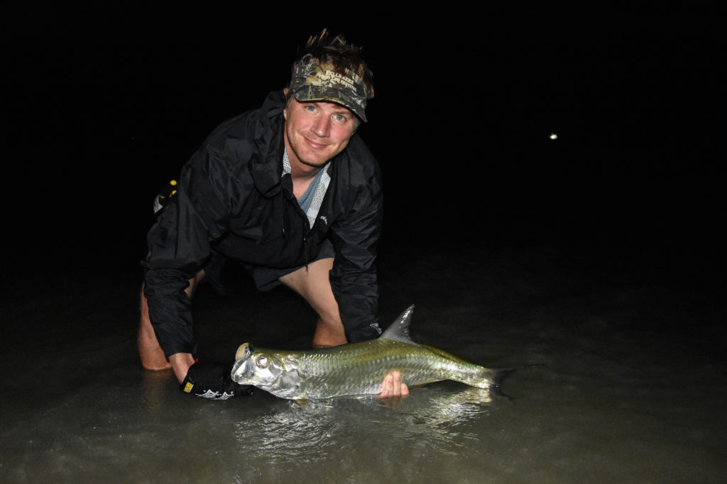 John hoover is holding a juvenile tarpon caught on fly off of key west