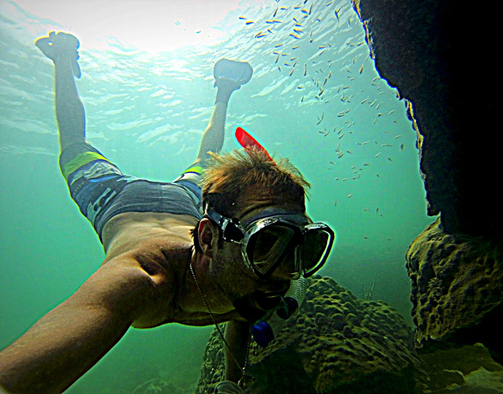 Here is a underwater shot of captain nick snorkeling a coral formation off of key west.