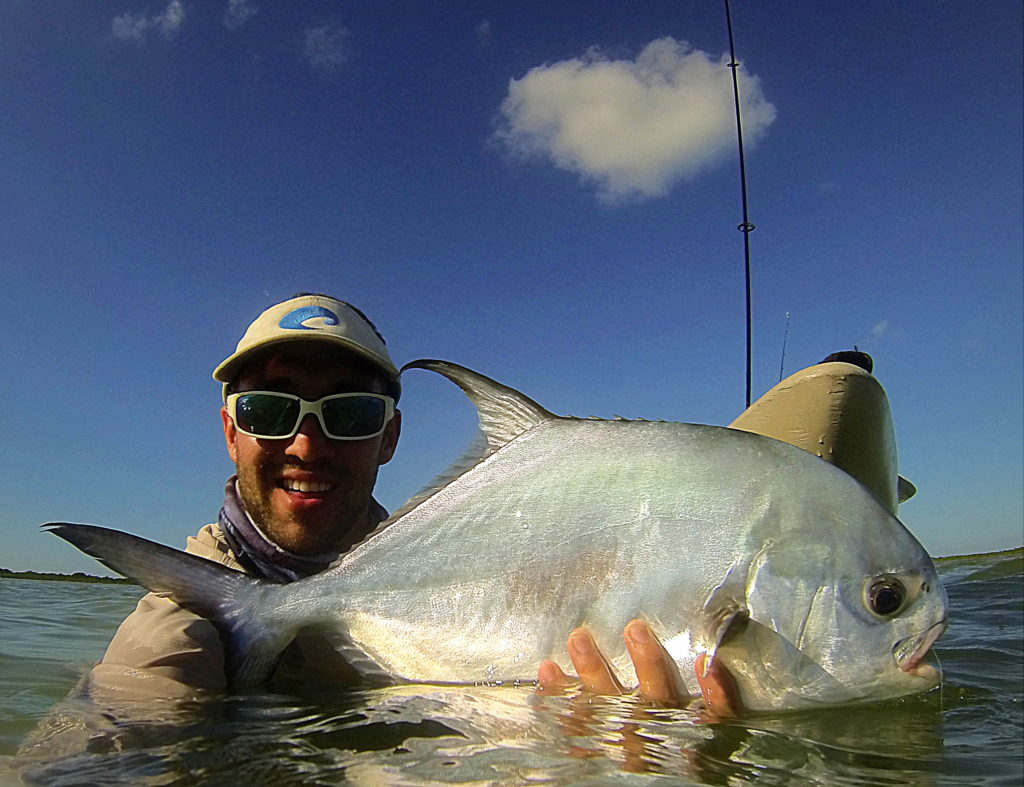 Capt. Nick LaBadie holds a permit he caught while kayaking on the flats in the Florida Keys.